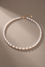 DropIQ white rice pearl strand necklace with gold spacer beads